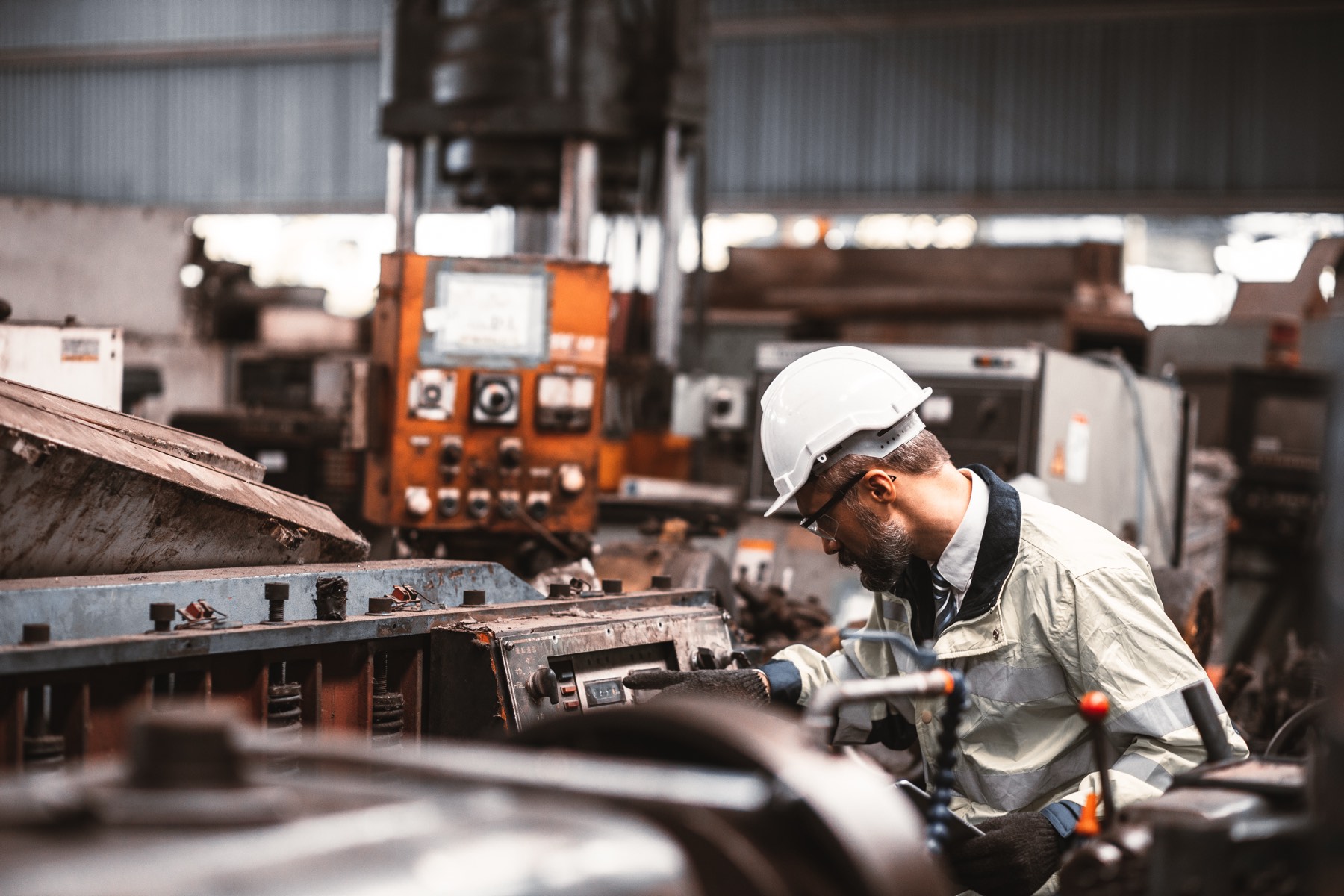 Technician working with industrial machinery